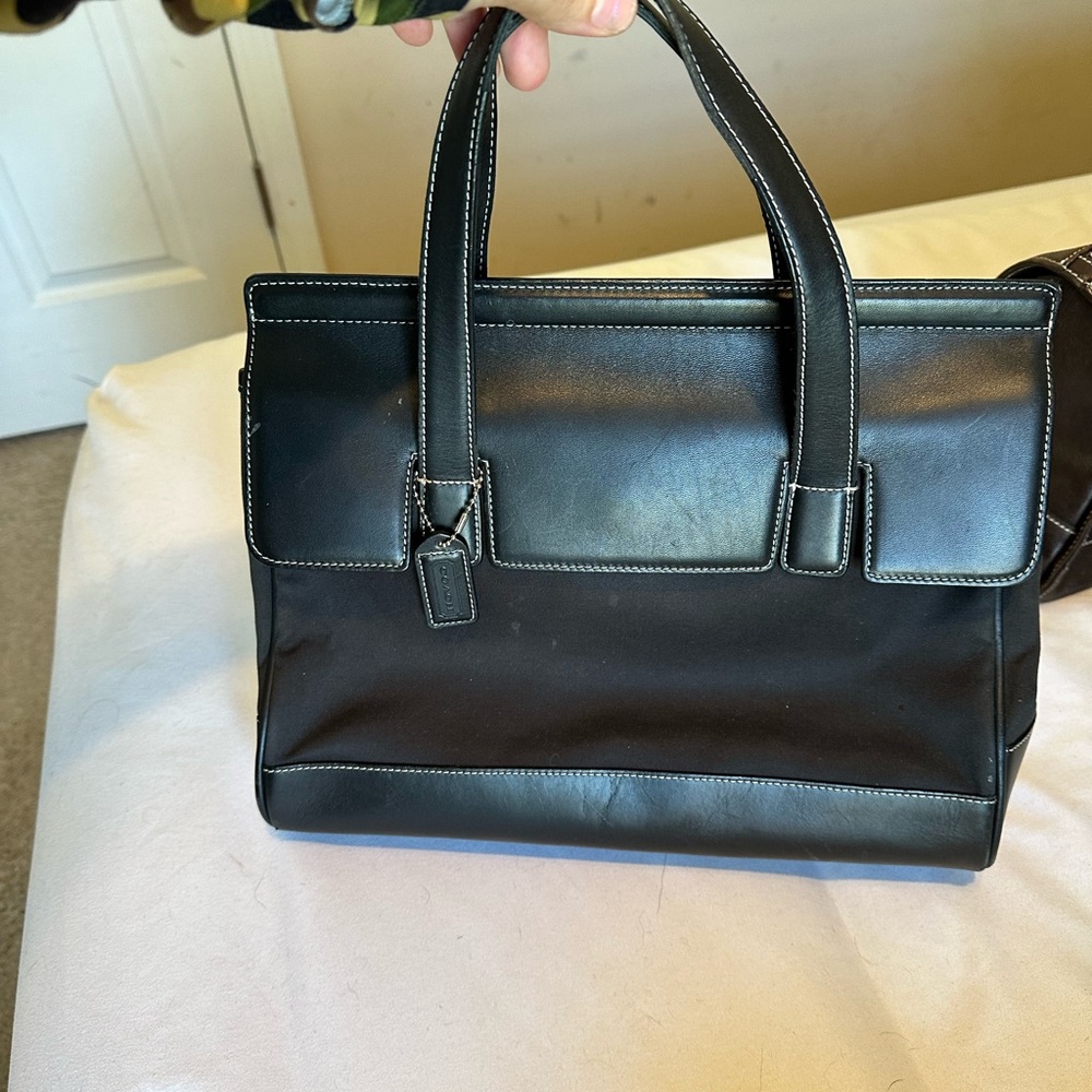 Sleek Black Leather-Trimmed Coach Tote with Contrast Stitching